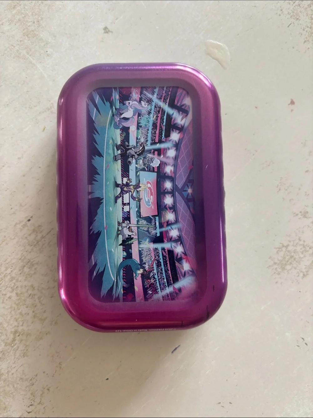 Pokemon tin with 32 cards inside